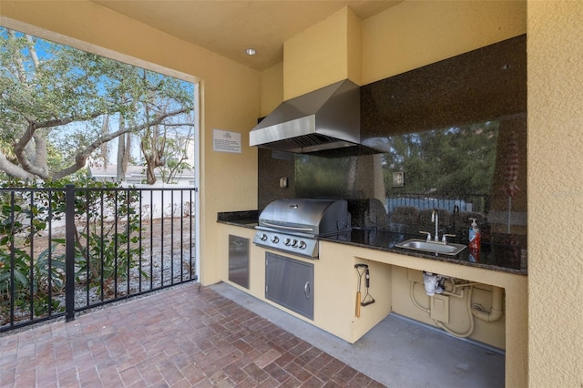 view of patio featuring an outdoor kitchen, area for grilling, and sink