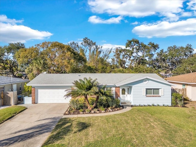 ranch-style house with a garage and a front yard