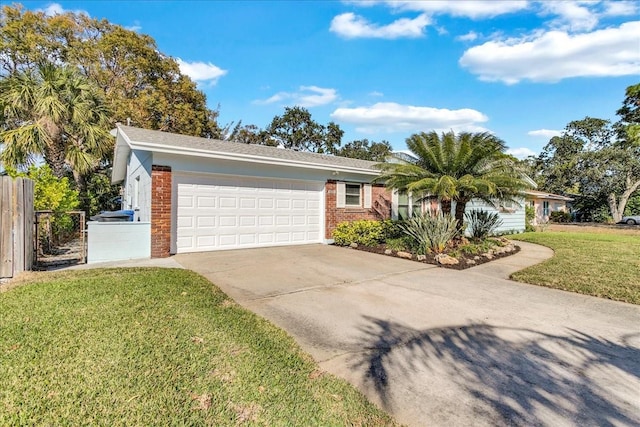 ranch-style home with a garage and a front yard