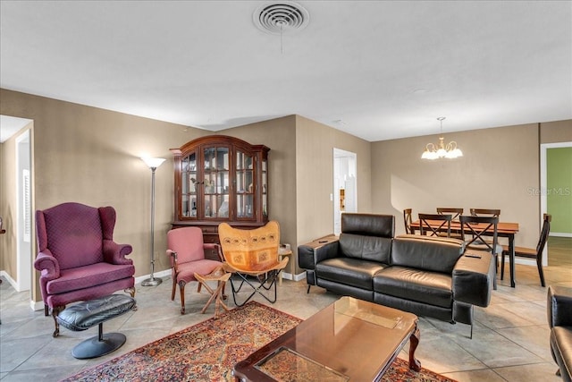 living room featuring light tile patterned floors and a chandelier