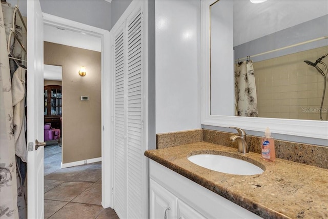 bathroom with vanity, tile patterned flooring, and a shower with shower curtain