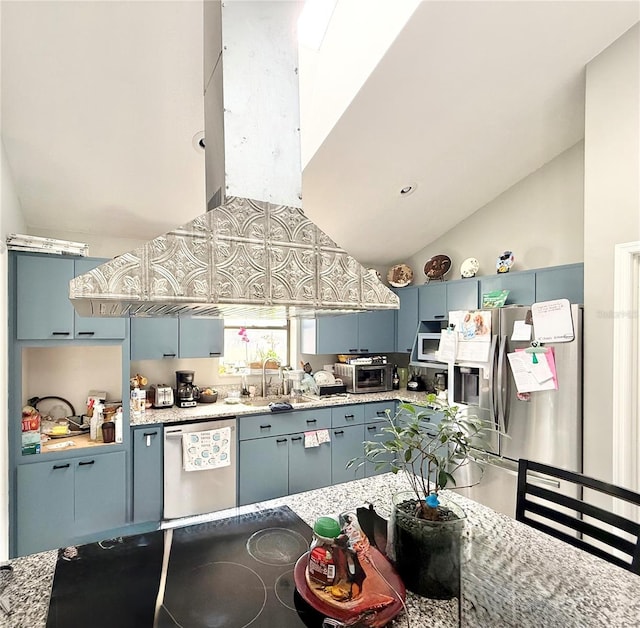 kitchen featuring sink, blue cabinetry, appliances with stainless steel finishes, high vaulted ceiling, and light stone countertops