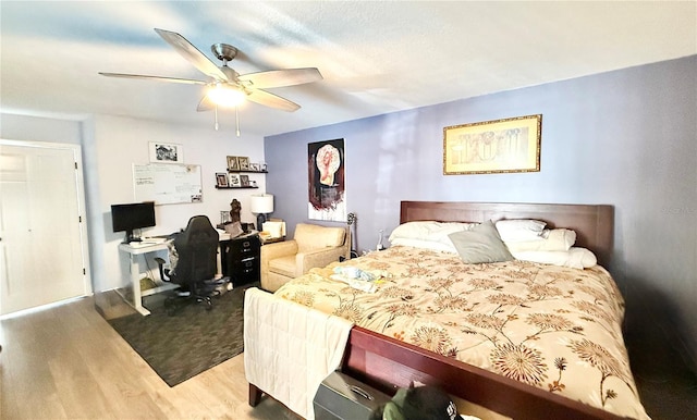 bedroom featuring hardwood / wood-style floors and ceiling fan