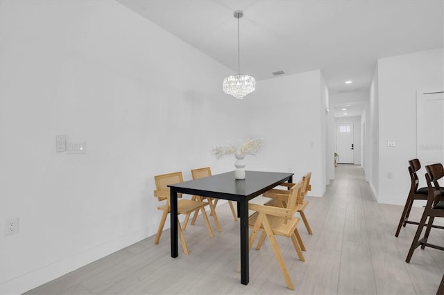 dining room with a notable chandelier