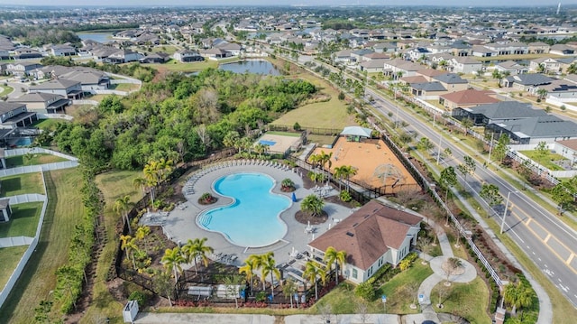 bird's eye view featuring a residential view and a water view