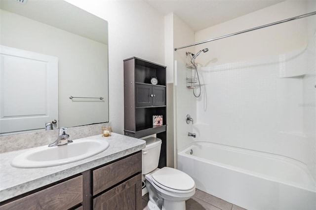 full bath with tile patterned floors, toilet, vanity, and shower / tub combination