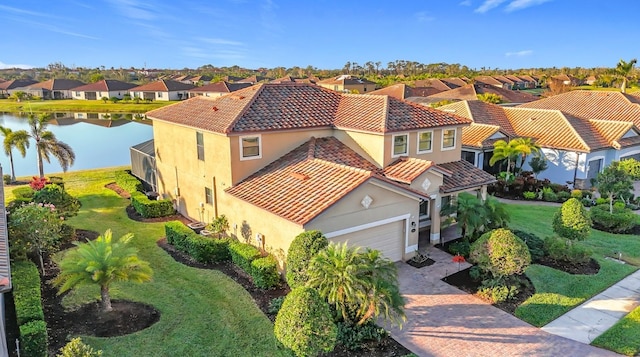 birds eye view of property with a water view