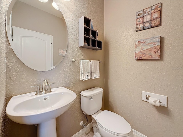 bathroom with sink and toilet