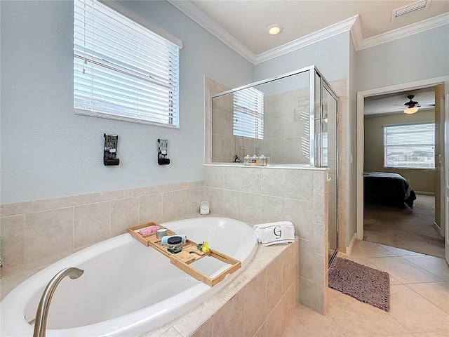 bathroom with crown molding, tile patterned floors, and shower with separate bathtub