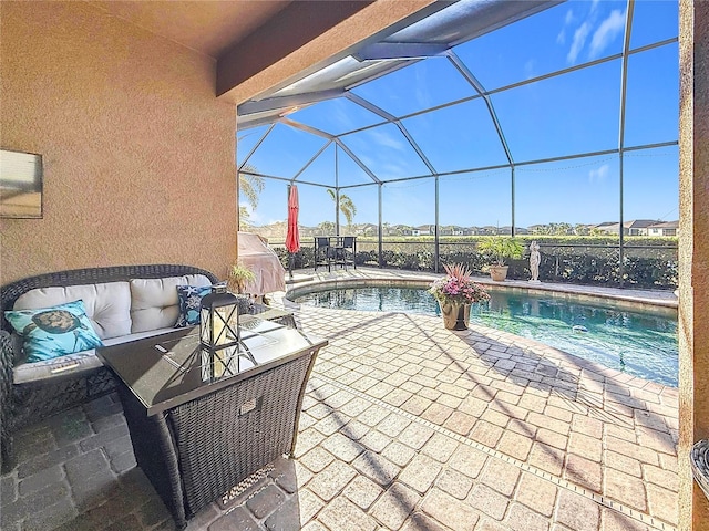 view of pool with a patio, a lanai, and an outdoor hangout area