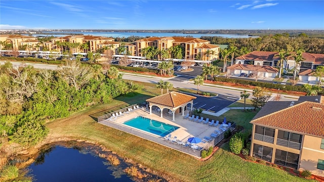 birds eye view of property with a water view