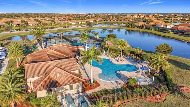 birds eye view of property with a water view