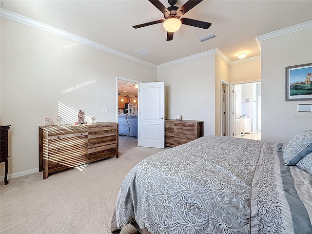 bedroom with ornamental molding, carpet flooring, ceiling fan, and ensuite bath