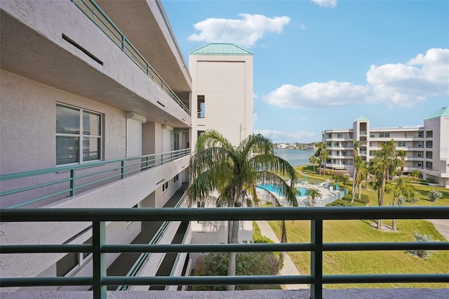 balcony featuring a water view