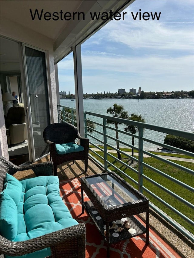 balcony featuring a water view