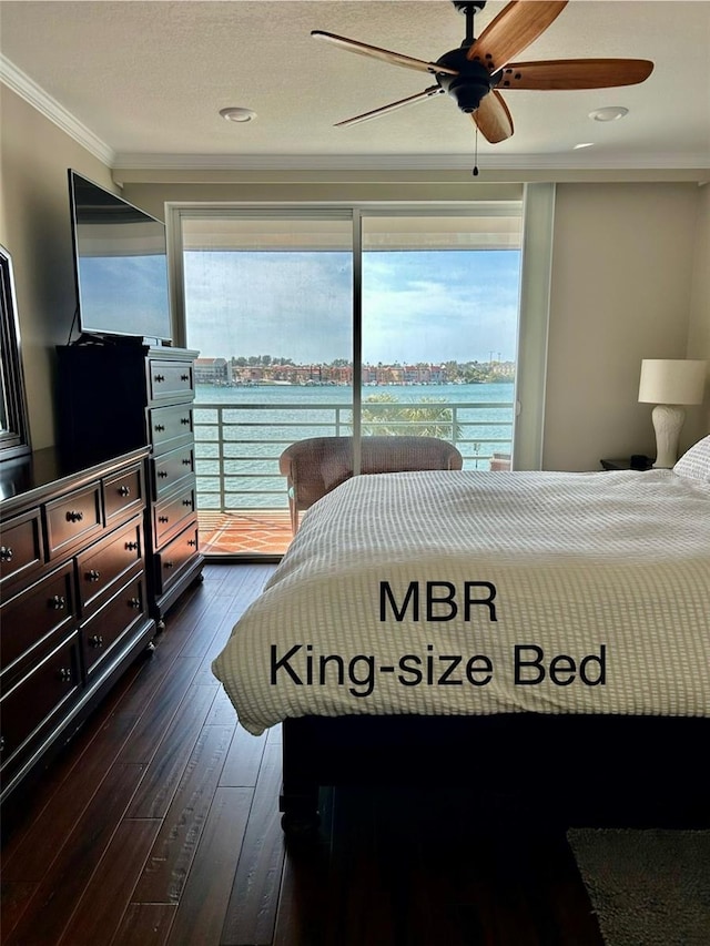 bedroom with dark hardwood / wood-style flooring, access to exterior, ceiling fan, crown molding, and a water view