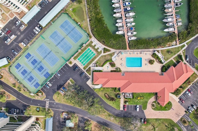 birds eye view of property with a water view