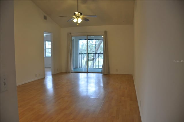 unfurnished room featuring ceiling fan, vaulted ceiling, and light hardwood / wood-style flooring