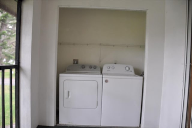 laundry area with washing machine and clothes dryer