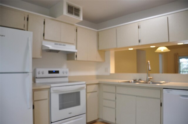 kitchen with sink and white appliances