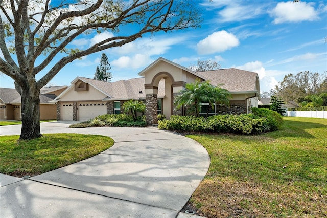 view of front of property with a garage and a front lawn