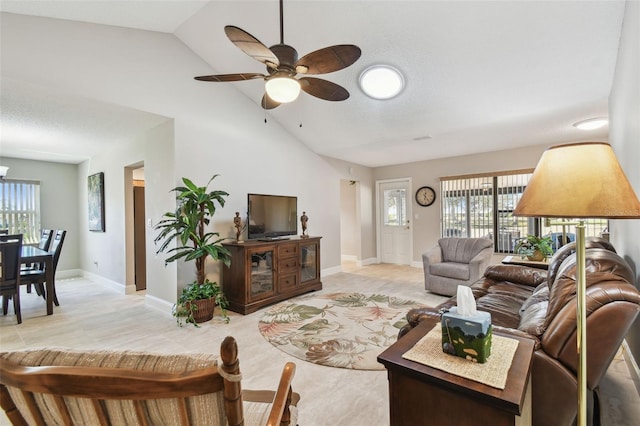 living room featuring high vaulted ceiling and ceiling fan