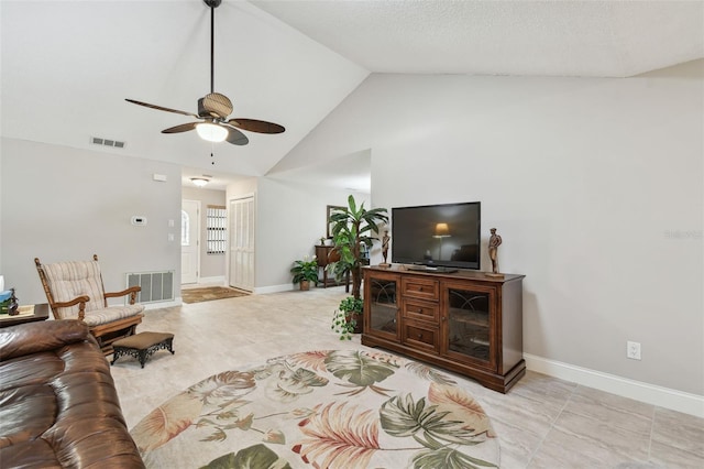 living room with ceiling fan and high vaulted ceiling