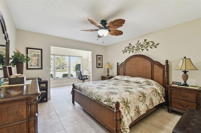 bedroom featuring ceiling fan, a textured ceiling, and light tile patterned floors