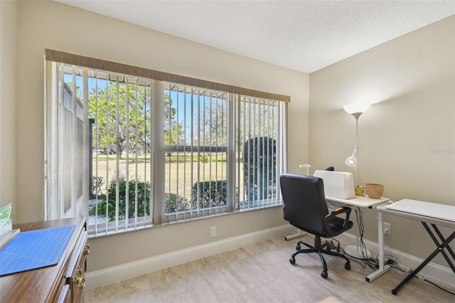 home office with light tile patterned flooring and a textured ceiling