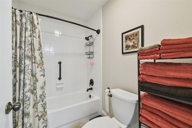 bathroom featuring shower / bath combo and toilet