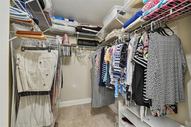 spacious closet with tile patterned flooring