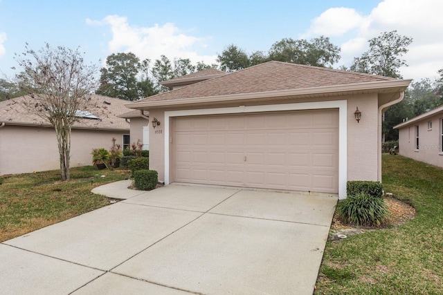 view of front facade with a garage and a front yard