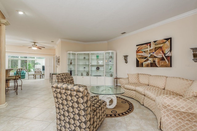 tiled living room featuring ornamental molding and ceiling fan