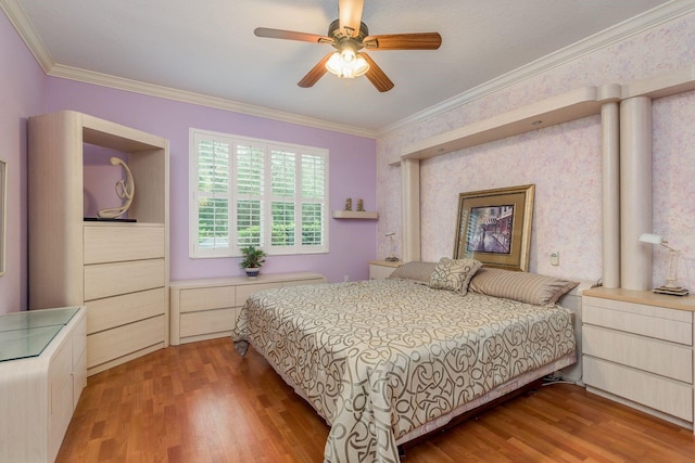 bedroom featuring ceiling fan, ornamental molding, and light wood-type flooring