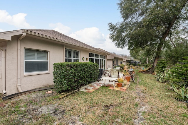 exterior space with a lawn