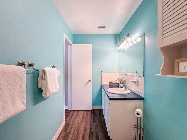 bathroom with vanity and wood-type flooring