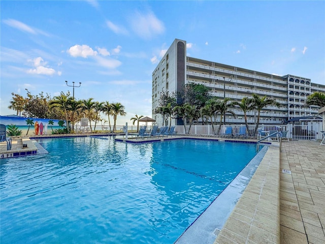 view of swimming pool with a patio