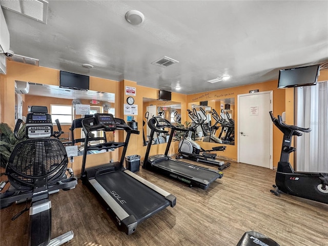 workout area featuring wood-type flooring