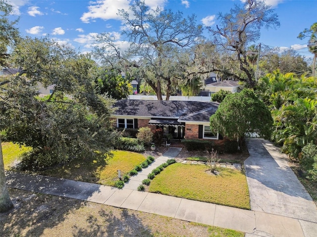 ranch-style house with a front lawn