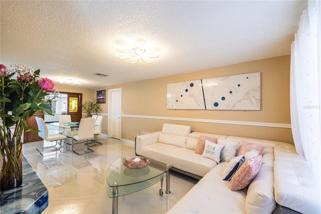 living room featuring a textured ceiling