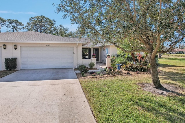 ranch-style house featuring a garage and a front yard