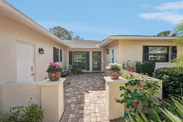 entrance to property with a patio area