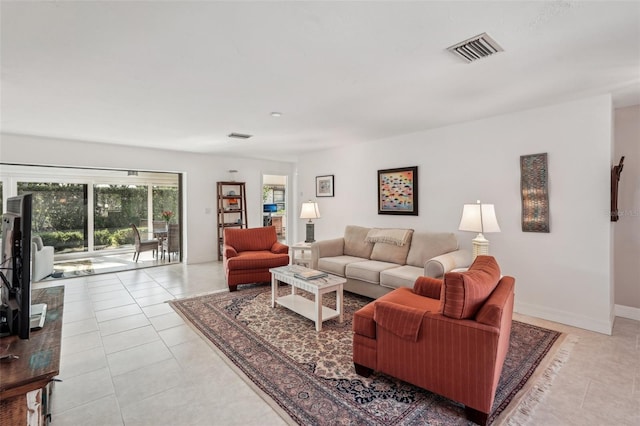 living room with light tile patterned flooring