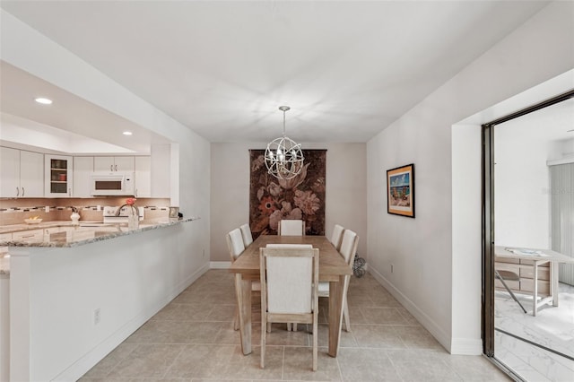 dining space featuring an inviting chandelier