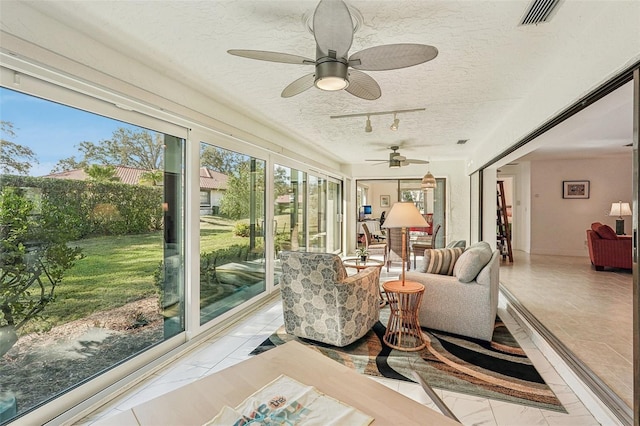 sunroom / solarium with rail lighting