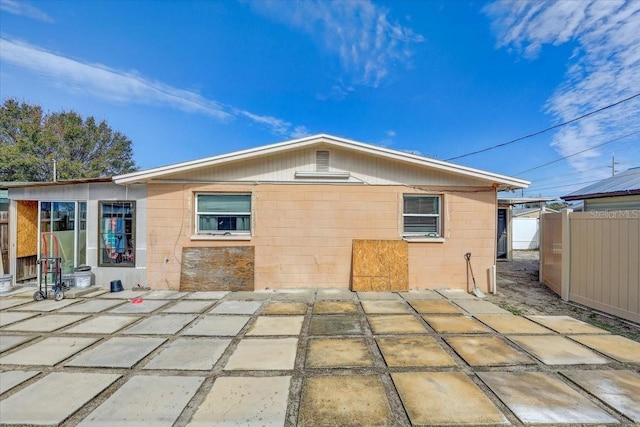 back of house with a patio