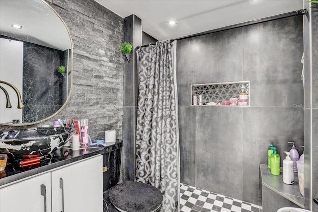 bathroom with vanity and curtained shower