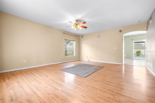 spare room with light hardwood / wood-style floors and ceiling fan