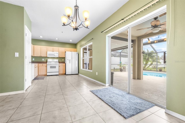 kitchen with ceiling fan with notable chandelier, pendant lighting, light brown cabinetry, light tile patterned floors, and white appliances