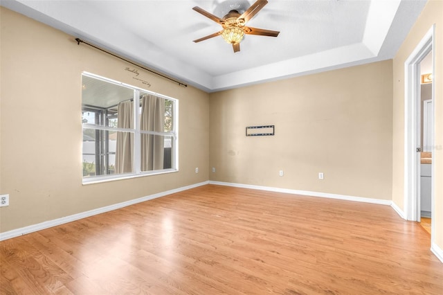 unfurnished room with ceiling fan and light hardwood / wood-style flooring